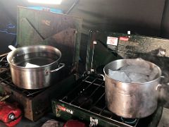 04B Melting Ice For Water On Our Portable Stoves Inside The Kitchen Tent At Our Bylot Island Camp On Floe Edge Adventure Nunavut Canada